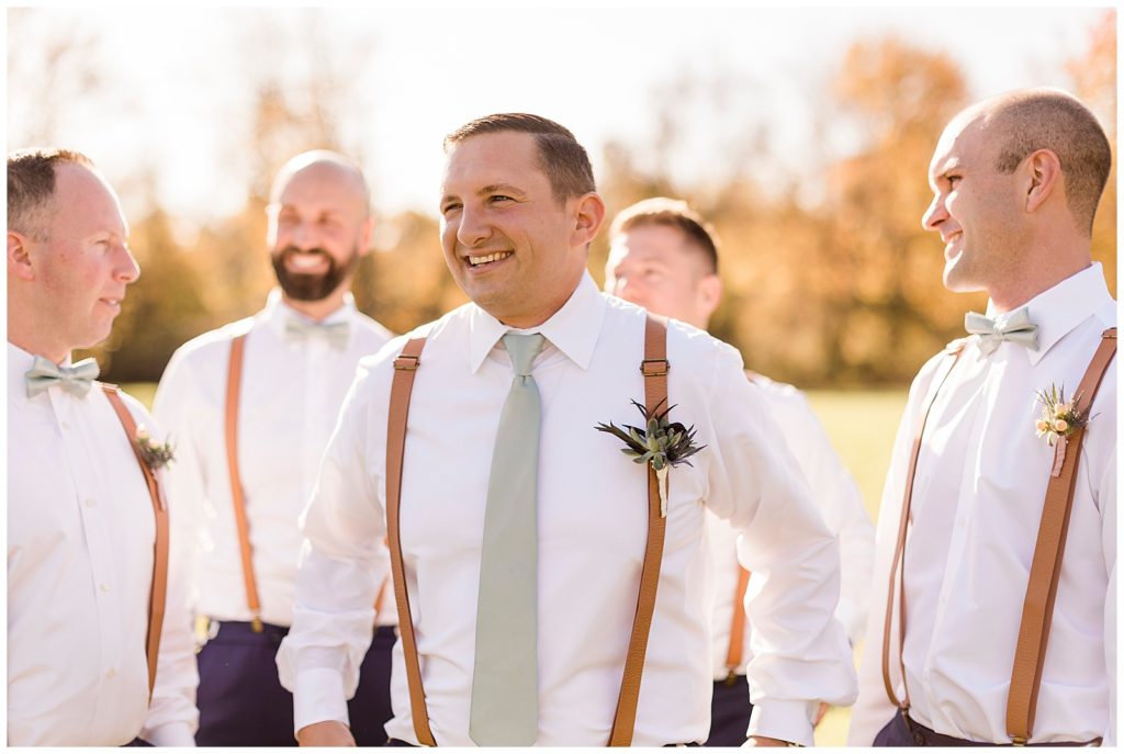 groom with suspenders